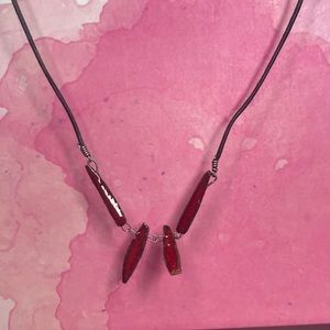 Leather corded necklace with maroon/red crystal rock beads